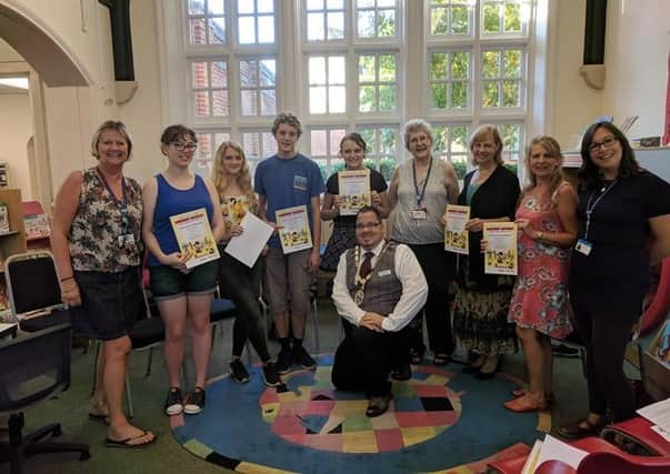 Library volunteers giving up their time for the summer reading challenge were given certificates