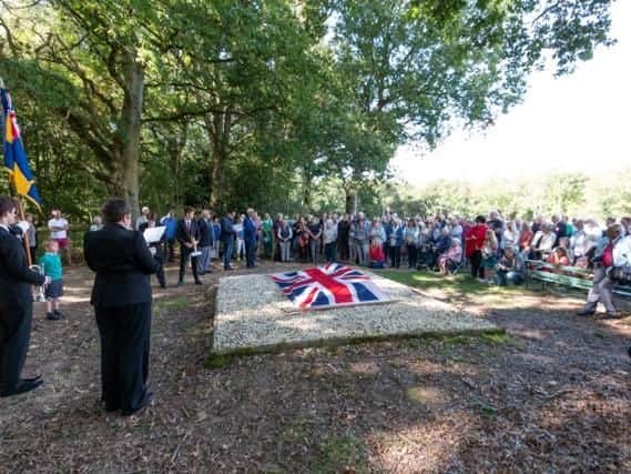 The union flag was removed to reveal the plaque