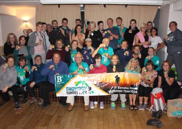 St Barnabas House trekkers celebrate completing the Snowdon Sunset Trek