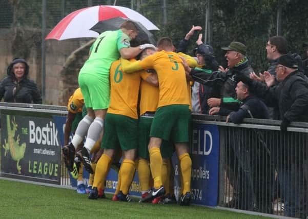 Horsham players - including goalkeeper Josh Pelling celebrate Chris Smith's goal against Heybridge Swifts on Saturday. Picture by John Lines