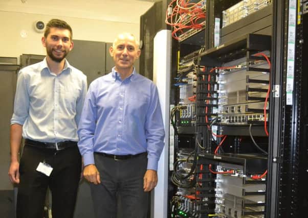 Jack Westcott, IT Network Engineer, and Gary Steen, Chief
Technology Officer, at the heart of the new WiFi System.