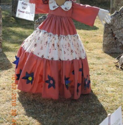 Flora the Flowergirl was among the scarecrow displayed  in the churchyard with the theme of 'The Wedding Party'