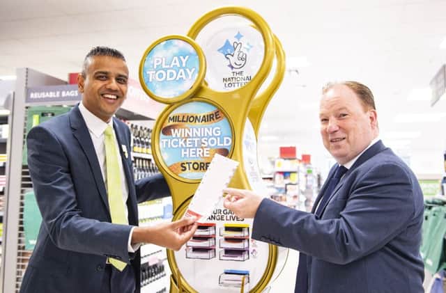 The new Gold Lottery Stand at the Waitrose store in Market Place Shopping Centre Burgess Hill. 
Minesh Patel manager of Waitrose (left) with Andrew Harvey the centre manager. 


Photograph taken by Simon Dack/Vervate