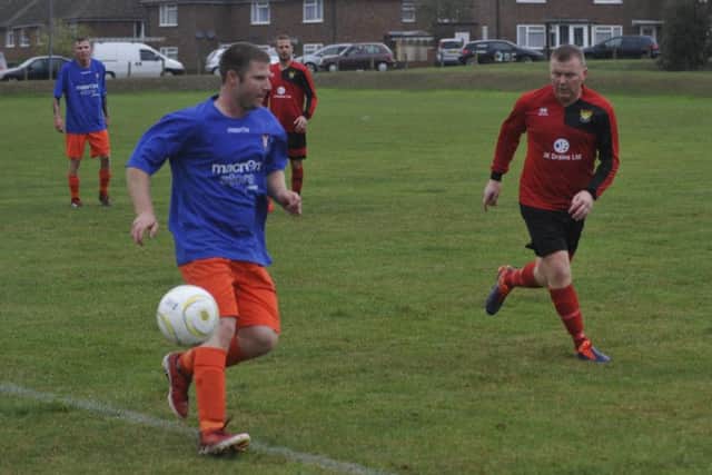 Jamie Lindsay on the ball for Premier Division leaders Battle Baptists against Bexhill AAC.