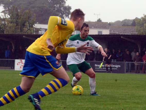 Calvin Davies on the ball against Sudbury at rain-soaked Nyewood Lane / Picture by Kate Shemilt
