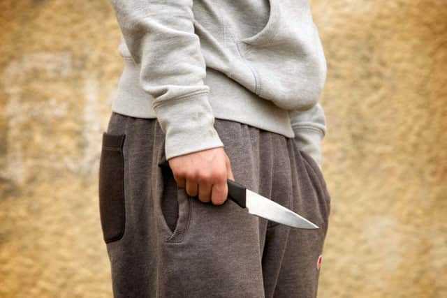 PICTURE POSED BY MODEL. A youth with a knife. Police recorded 39,598 offences involving a knife or sharp instrument in the latest year ending December 2017, a 22\% increase compared with the previous year (32,468), and the highest number registered since comparable records started in 2010. pa-news-20180426-101802-crime_st