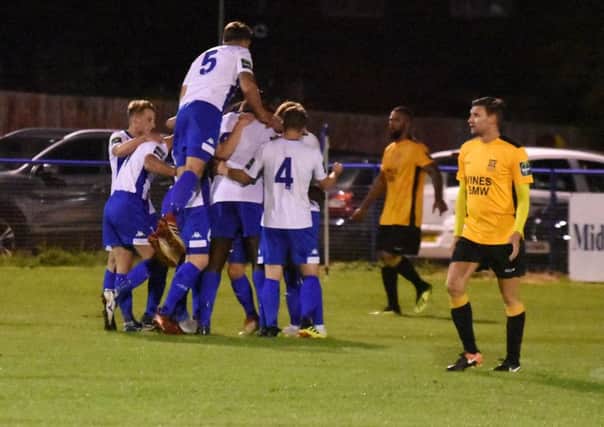 Celebrations after the first goal. Haywards Heath Town v Three Bridges. Picture by Grahame Lehkyj SUS-180926-110442001