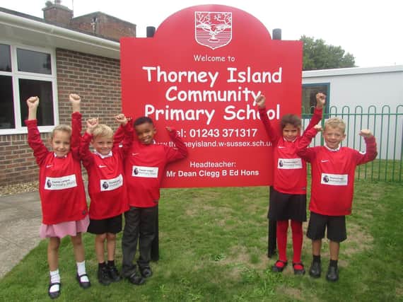 The Thorney Island Primary School team show off their new kit