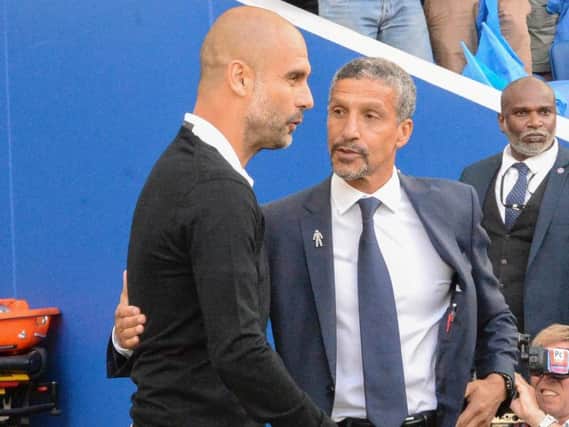 Pep Guardiola and Chris Hughton. Picture by PW Sporting Photography