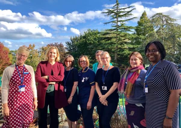 Amber meets staff at St Michael's Hospice SUS-180310-083643001