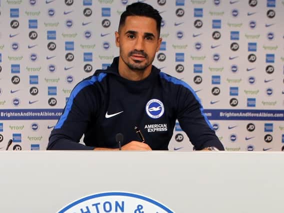 Beram Kayal signs his new deal. Picture by Paul Hazlewood/BHAFC