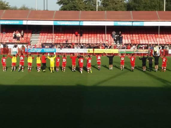 Crawley players show their appreciation to the fans at end of the game