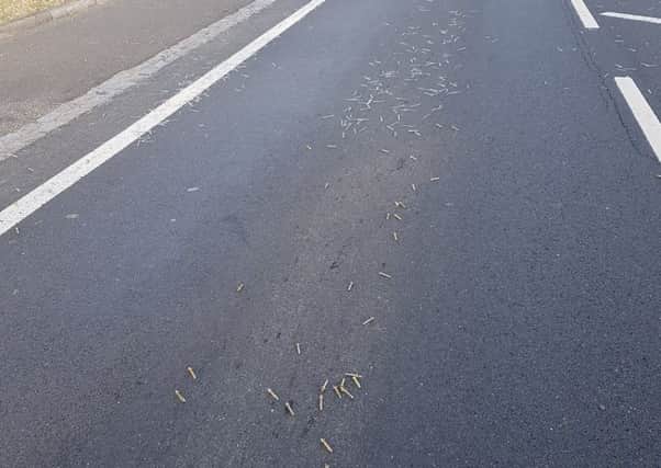 Hundreds of screws and other bits of metal hardware were found scattered along the A22 at Lower Dicker. Picture: Sussex Roads Police