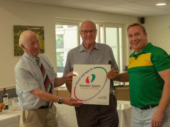 Bob Rogers (on the left) Chairman of the Sussex Branch of the Wooden Spoon presenting the shield to (centre) Vice President Alan Lambkin and (on the right) Club Captain Mark Brown. Photo by Ian McBean Photography.