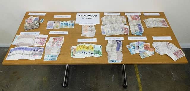 Â£23,000 cash seized at one of the addresses when detectives made the first arrests in July 2017 (Photograph: Sussex Police)