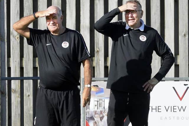 Horsham YMCA boss Peter Buckland and his assistant Julian Miller watch on. Picture by Jon Rigby.