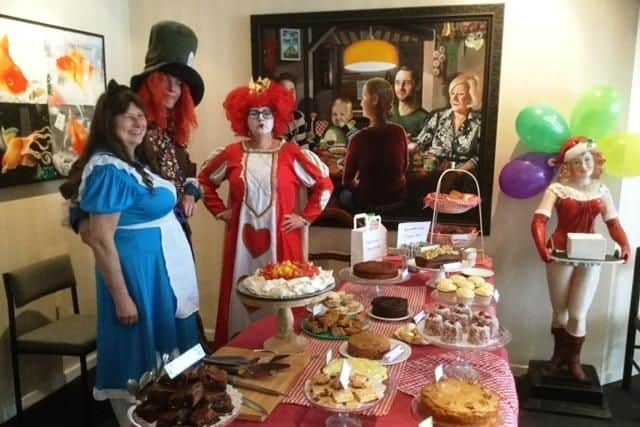 Secretary Michelle Jones dressed up as the Queen of Hearts, secretary Lesley Shine as Alice and legal apprentice Edward Whitting as the Mad Hatter at A.R. Brown & Co in Worthing