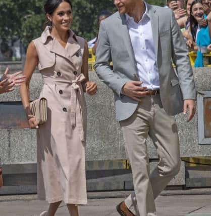 The Duke and Duchess of Sussex during their visit to the Nelson Mandela centenary exhibition at Southbank Centre's Queen Elizabeth Hall, London. PRESS ASSOCIATION Photo. Picture date: Tuesday July 17, 2018. The exhibition features photographs, archive footage and information panels telling the former South African President's story around six themes. See PA story ROYAL Sussex. Photo credit should read: Arthur Edwards/The Sun/PA Wire
