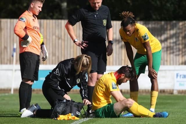 Lewis Hyde was left bloodied after a collision in the air with Bury Town's 'keeper Luis Tibbles on 15 minutes and had to be substituted. Picture by John Lines.