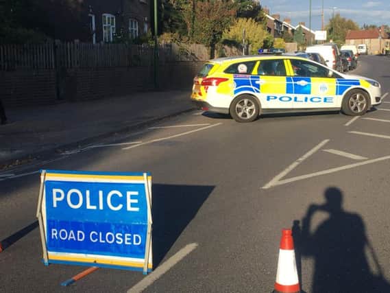 Police have closed Spitalfield Lane