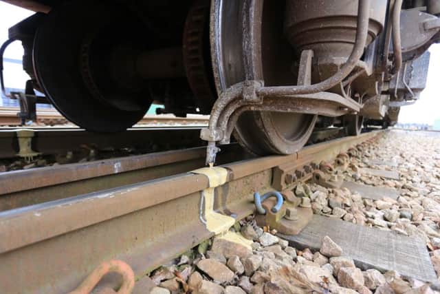 Trains spread a gel mixed with sand over the tracks to help trains grip better