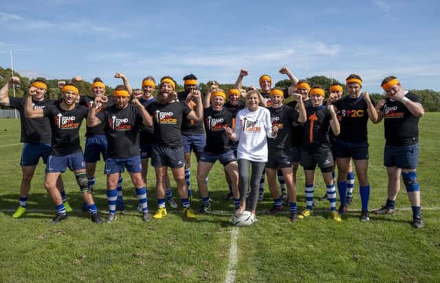 Members of the Hastings and Bexhill Rugby Club first team doing Haka-style poses before their match on Saturday 'To Stand Up To Cancer'
They are supporting Ann Sandeman  (pictured here) who has cancer and is a member of the rugby club. Photo by Liz Finlayson/Vervate SUS-180310-112642001