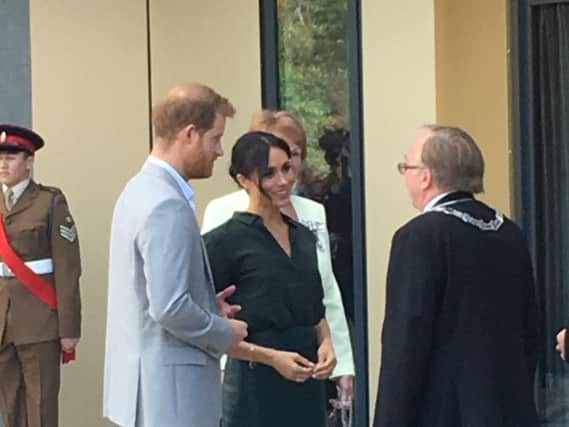 The royal couple speaking with the chairman of Arun District Council