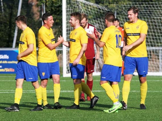 Lancing celebrate a goal in the thrilling win over Little Common. Picture by Derek Martin