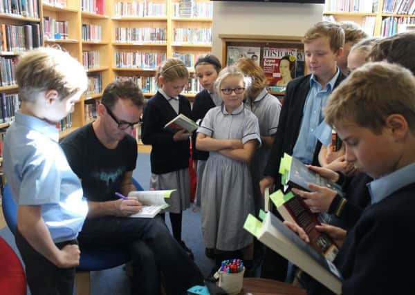 Author Gareth P. Jones with Cranleigh Prep School pupils SUS-180310-135353001