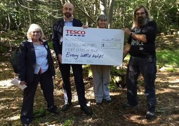 Anne Bllom, Tesco community champion, store manager Antony Henson,  wood owner Lyn Glanz, and Ian Powell, MAVES licensed dormouse handler