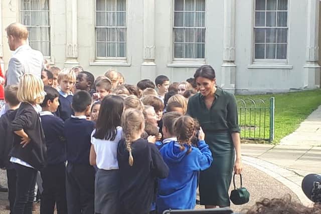 Harry and Meghan with children from Queen's Park School in Brighton