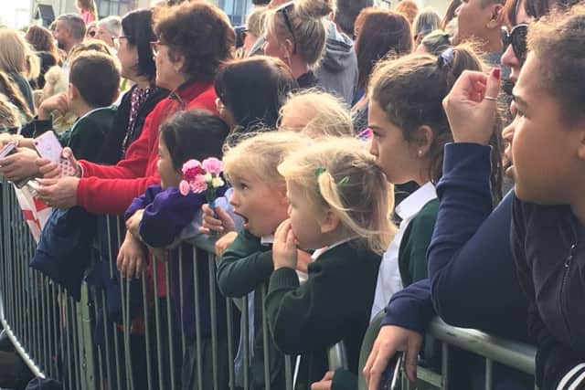 A youngster is open-mouthed with awe during the royal visit