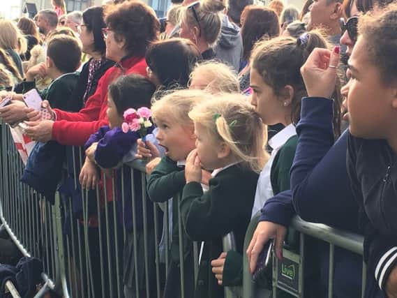 A youngster is open-mouthed with awe during the royal visit