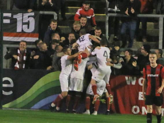 Ten-man Worthing celebrate a goal in the win at Lewes. Picture by Angela Brinkhurst