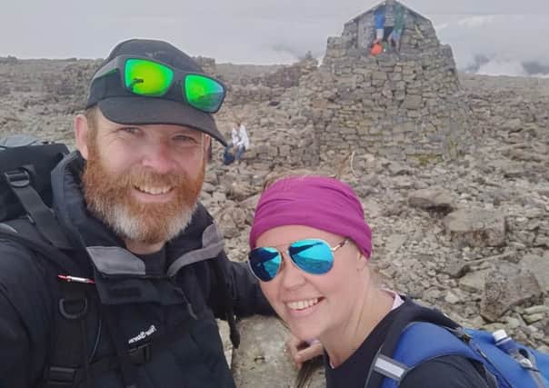 Ieuan and Rosie Ford on top of Ben Nevis, the highest peak in the UK and included in their nine-peak challenge which saw them climbing mountains in England, Scotland and Wales SUS-180910-104927001