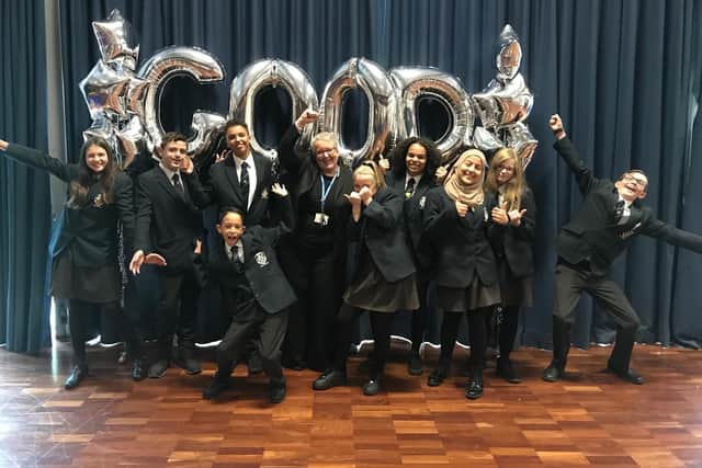 Pupils and headteacher Kate Williams celebrate the good rating from Ofsted