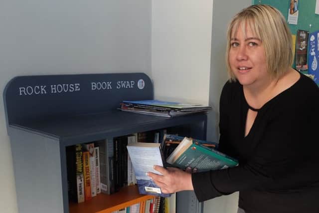 Angie Lowe HFS Projects Manager with the Rock House BookSwapBox SUS-181010-110725001