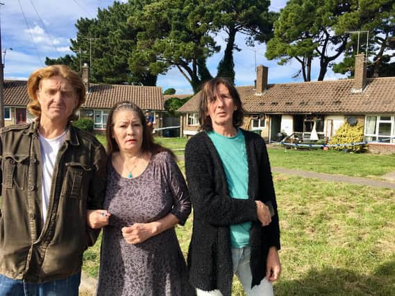 Tom Rowland, 46, and his neighbours Roberta Fleeton, 62, and Anthony Quinn, 64, outside Tom's house in Lawrence Avenue, Rustington, which was destroyed in the fire