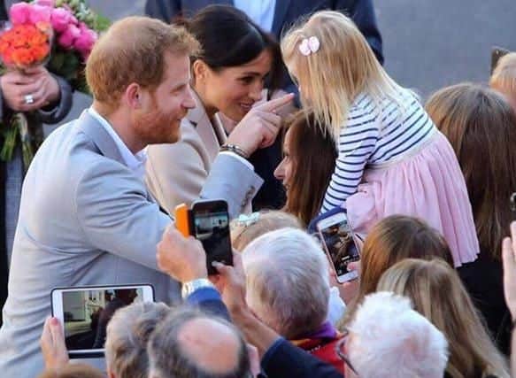 Freya Martin, 2, with Prince Harry and Meghan. Picture contributed