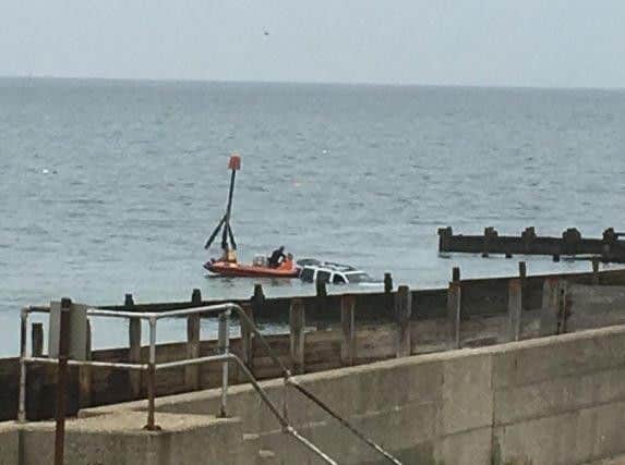 The 4x4 vehicle slipped off a ramp at East Beach, Selsey. Picture courtesy of RNLI Selsey