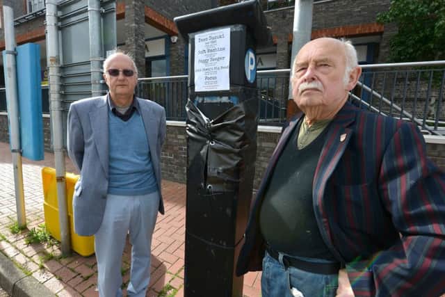 Cllr Graham Mayhew (left) and Cllr Stephen Catlin with the offending cash machine