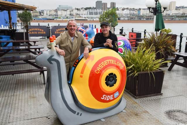 Norman Cook (left) aka Fatboy Slim with artist Martin Middleton aka Cassettelord with their snail at the launch of the Snailspace Art Trail(Photograph: Simon Dack/Vervate) SUS-180913-131327001