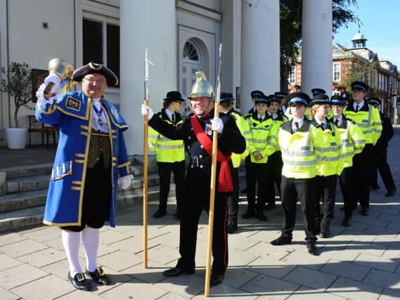 Town crier Bob Smytherman leads the procession