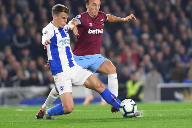 Solly March under pressure from Mark Noble. Picture by PW Sporting Photography