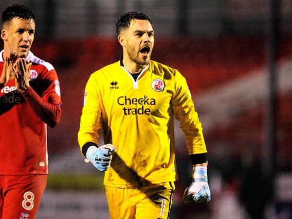 Glenn Morris, pictured last season, kept Crawley in the game with a string of superb saves against Cambridge