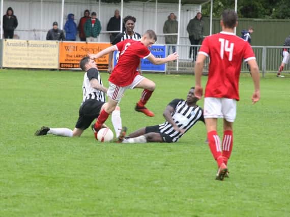 Action from Arundel's league clash with Peacehaven & Telscombe. Picture by Derek Martin