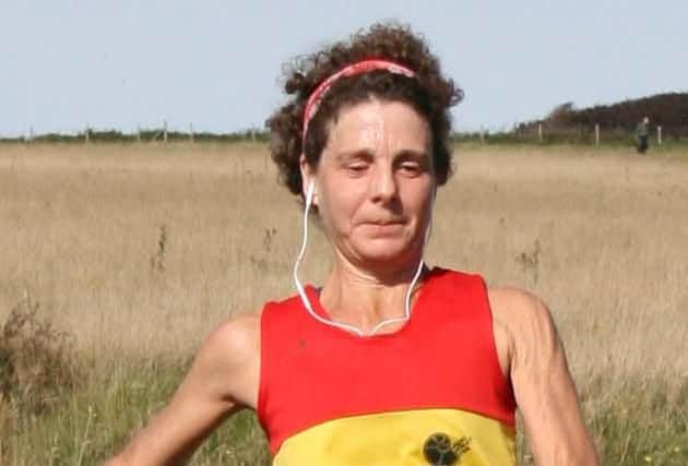Helen Sida winning the womens race, leading the Lewes AC womens team to first place and also winning the women aged over 50  award.