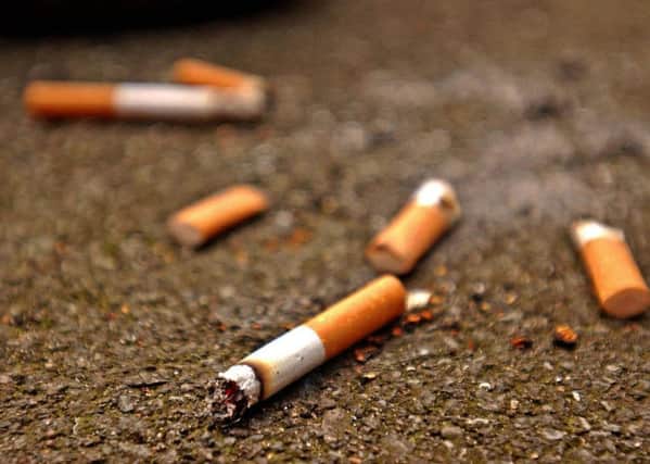 Undated handout photo of cigarette butts in the street. PRESS ASSOCIATION Photo. Issue date: Friday September 14, 2007. The number of cigarette butts dropped on the streets of England has gone up by more than 40% since the smoking ban was brought in, litter campaigners said today. Keep Britain Tidy said the English were much worse for dropping cigarette ends than the rest of the UK. See PA Story ENVIRONMENT Cigarettes. Photo credit should read: Ken Lennox/PA Wire pa_news_20050206_092001_environm