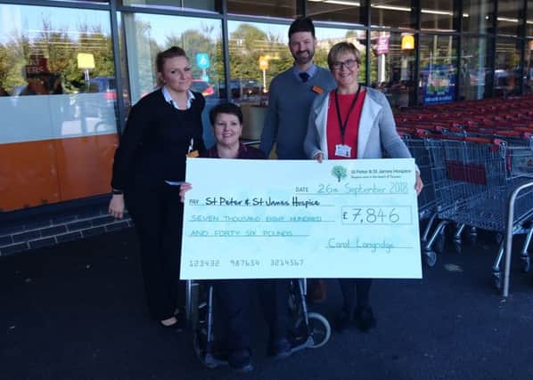 Carol with her managers, Hannah and Mark, and community fundraising manager, Wendy Agate, outside Sainsburys.