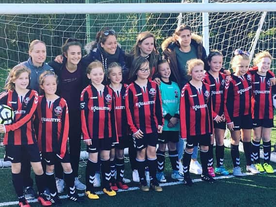 Lewes FC Women players Natasha Wells (Left Back) and Amy Taylor (Centre Back) supporting the Under 10s at their match on Sunday. Tash and Amy are in the back row.